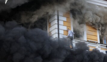 People try to escape burning National Academy of Sciences building in Kyiv after Russian strike People try to escape burning National Academy of Sciences building in Kyiv after Russian strike